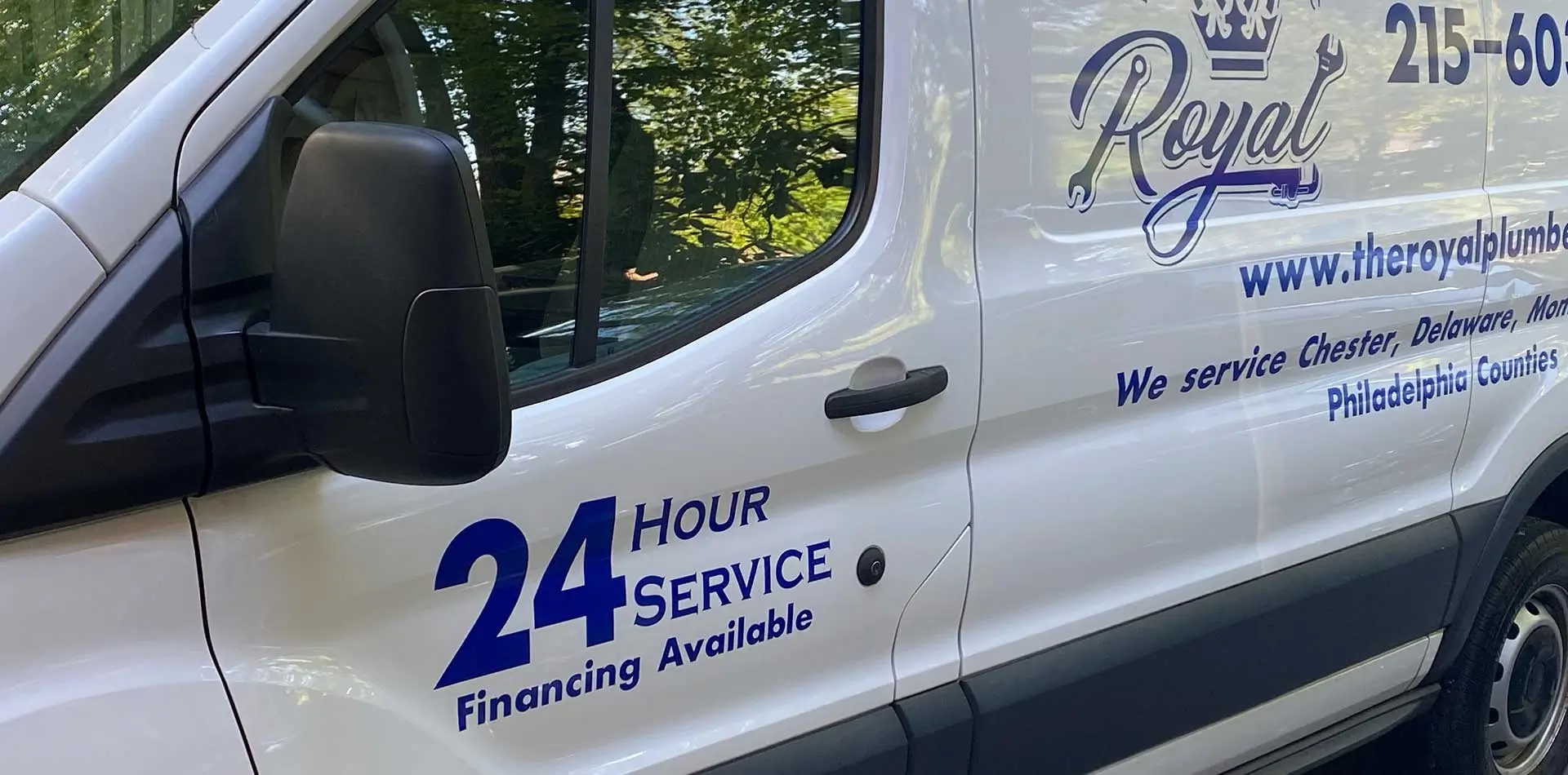 Royal’s actual white service van with blue script logo and crown, photographed for the company website.